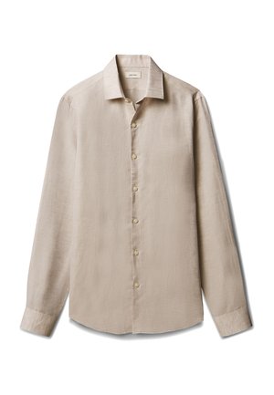 Chemise beige à manches longues, boutonnée, avec col, poignets et boutons visibles, posée à plat sur fond blanc.