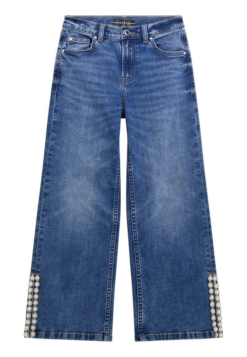 Szerokie niebieskie dżinsy z perłowymi zdobieniami na dolnej części. Posiadają standardowe kieszenie oraz zamek błyskawiczny z zapięciem na guzik.