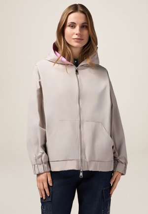Hellgraue Kapuzenjacke mit Reißverschluss, elastischen Bündchen und zwei Fronttaschen, mit pinkem Innenfutter und weichem Stoffgefühl.