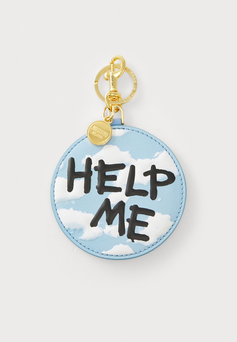 Round blue keychain featuring a cloud pattern with bold, black "HELP ME" text. Gold hardware includes a keyring attachment and charm.