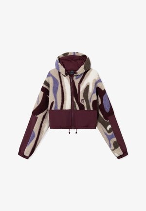 Rövidített, cipzáras dzseki, amely texturált bolyhos anyag és sima szövet keverékéből készült. Barna, lila és krém színű absztrakt mintázattal rendelkezik; állítható kapucnival.