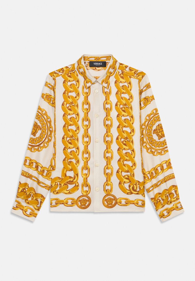 Hemd in Creme mit auffälligem Druck von goldenen Ketten und Medaillen-Details. Hat lange Ärmel und einen klassischen Kragen. Weicher Stoff.