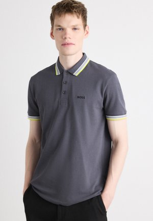 Gray polo shirt with striped collar and sleeves featuring green accents, three-button placket, and small black logo on the chest.