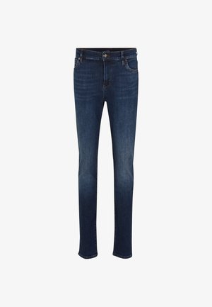 Donkerblauwe denim jeans met een nauwsluitende pasvorm, vijf zakken en een rits. Bevat subtiele vervaging en contrasterende stiksels. Klassiek ontwerp.