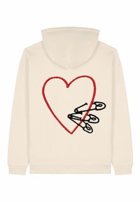 Felpa beige con cappuccio caratterizzata da un cuore ricamato rosso e spille da balia nere al centro, con polsini e orlo a costine.