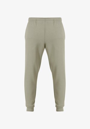 Lichtgroene joggers met een relaxte pasvorm, elastische tailleband en aangesloten enkels. Gemaakt van zacht materiaal, met een gladde textuur en zonder patronen.