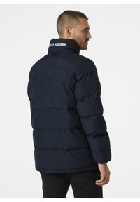 Helly Hansen YU 23 REVERSIBLE PUFFER - Chaqueta de invierno - navy