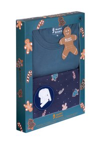 Ensemble de pyjama pour homme bleu moyen avec des motifs de pain d'épices et de cannes en sucre, dans un emballage festif.