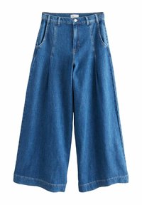 Laia denim püksid tumesinisest kangast, kõrge vöökohaga, volditud, vöökoharihmade ja kahe küljetaskuga. Sile tekstuur ja korralik õmblus.