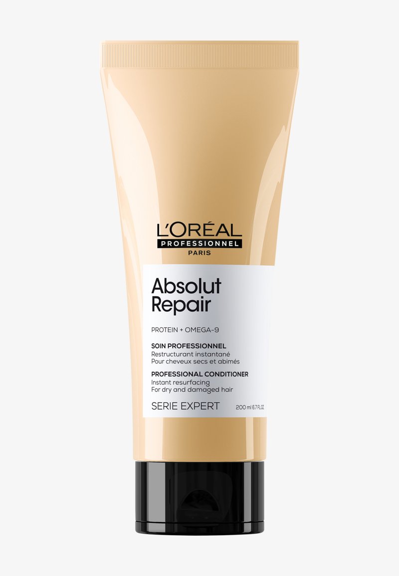 Odżywka L'Oréal Professionnel Absolut Repair w beżowej tubie o pojemności 200 ml z czarną podstawą. Posiada wyraźny tekst zawierający informacje o produkcie. Gładka tekstura.