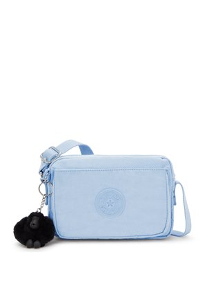 Light blue rectangular bag made of fabric, featuring a round logo patch, zip closure, and a black gorilla keychain attachment.