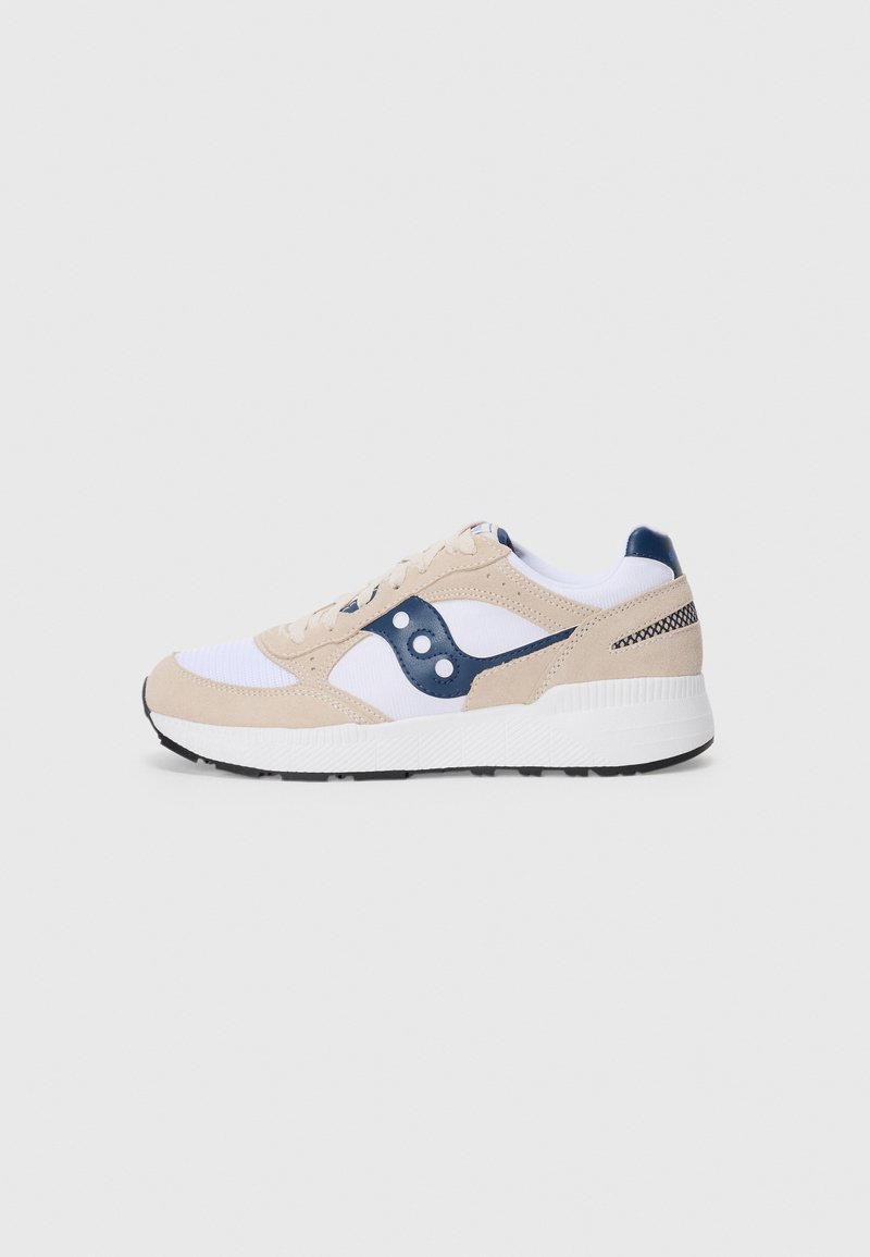 Beige and white sneaker with navy accents, featuring a textured suede upper, mesh panels, and a black outsole. Side logo with circular detail.