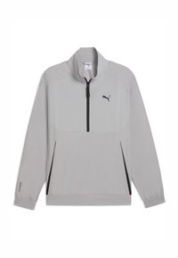 Chaqueta de pullover gris claro con media cremallera, que presenta un panel frontal con estampado, cremallera negra y puños elásticos. Diseño ligero y deportivo.