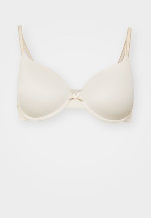 Beige push-up beugelbh met gladde, gevoerde cups, verstelbare bandjes en een klein strikje in het midden. Textuur materiaal overal.