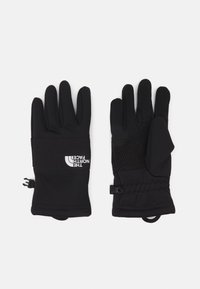 Black gloves with a snug fit, featuring a textured grip on the palm, elastic cuff, and logo detail on the wrist area. Smooth synthetic material.