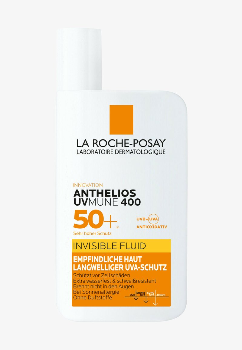 Sunscreen bottle, white plastic with orange and black text. Features prominent SPF 50+, waterproof claims, and "invisible fluid" label.
