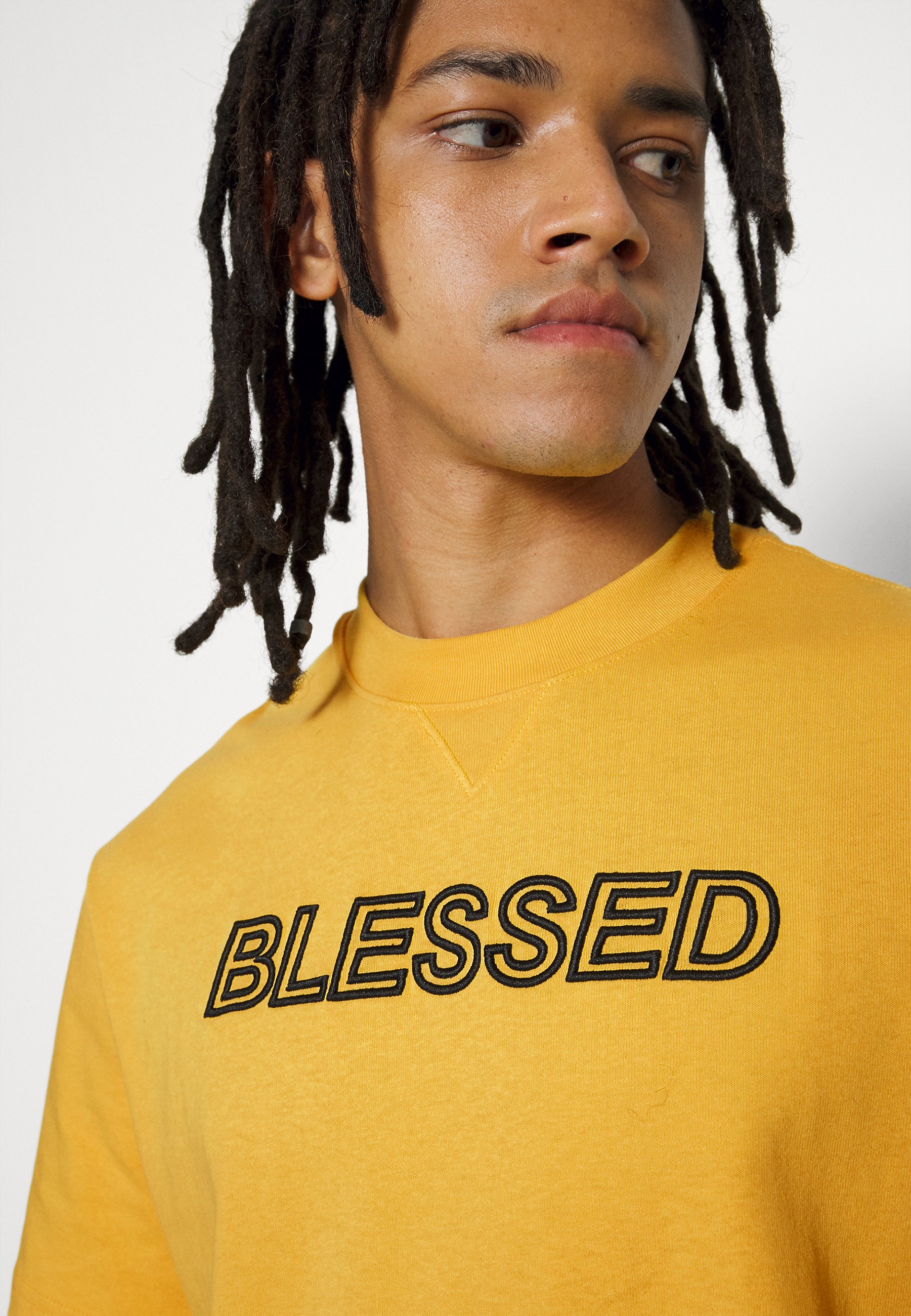 Puma TEE - Camiseta estampada - mimosa/amarillo - Zalando.es