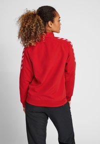 Hummel TRACK JACKET WOMAN - Trainingsvest - aura orange