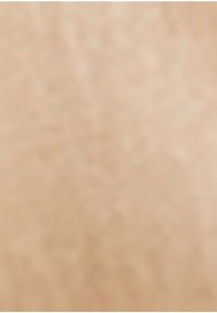 Surface texturée beige avec une apparence subtilement inégale. Le matériau présente une finition lisse avec de légères variations de profondeur de couleur.