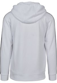 Hvit hettegenser med lange ermer, med svarte sidestiper og ribbede kanter. Laget av mykt stoff, den har et avslappet design.