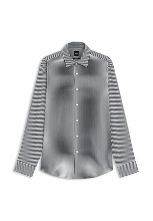 Black and white striped long-sleeve shirt with a collar, button front, and contrasting white cuff stripes. Made from a smooth fabric.