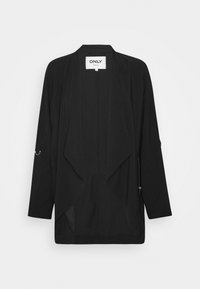 Veste noire de style kimono avec un devant ouvert, des manches longues et un ourlet asymétrique. Présente un tissu superposé et des accents en métal décoratifs.