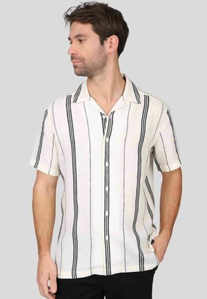 Chemise à manches courtes en tissu léger, avec des rayures noires verticales sur un fond crème, fermeture à boutons et col pointu.