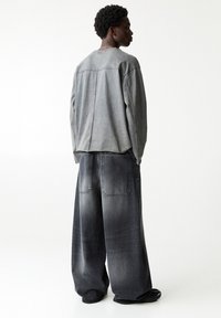 PULL&BEAR MEGA BAGGY - Jeans relaxed fit - black