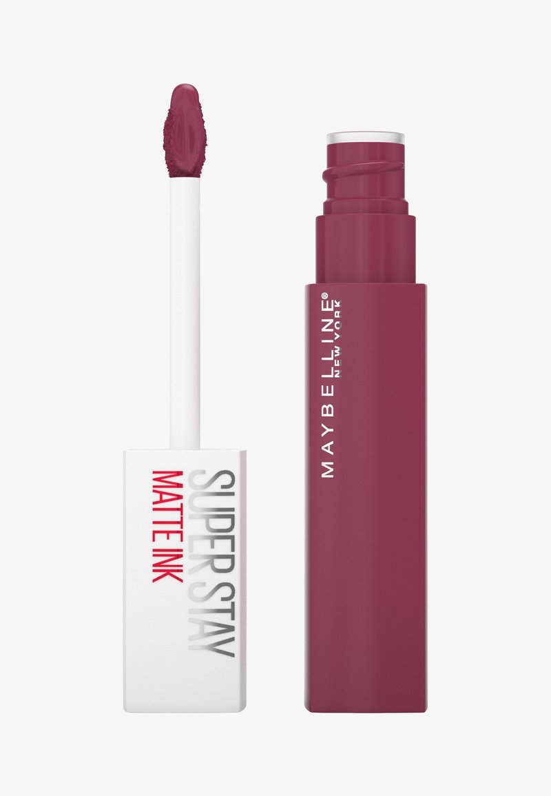 Liquidna szminka Maybelline Super Stay Matte Ink w głębokim odcieniu śliwkowym. Biała prostokątna aplikator z teksturowanym końcówką, elegancka bordowa tubka.