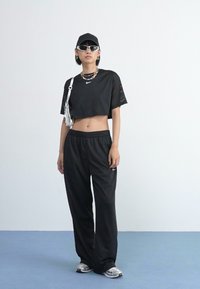 Nike Sportswear PANT COORD - Donji dijelovi trenirke - black