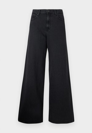 Sorte vidde denimjeans med høy midje og knappelukking foran, vist mot en enkel bakgrunn.