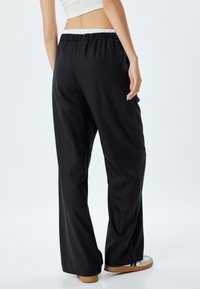 Koton Trainingsbroek - black