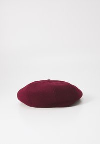 Burgundy wool beret, round shape, soft texture, featuring a top button, and distinct stitching details around the curved edge.