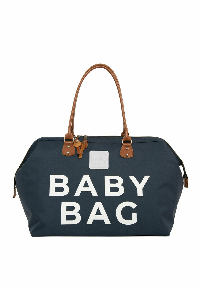 Tume kangas beebikott suure valge tekstiga "BABY BAG", pruunid nahklingid ja -tõmblukud. Omab struktureeritud disaini ja vastupidavat materjali.