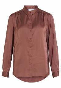 Brun satinblus med lång ärm, spetsig krage, knappar framtill och veckdetaljer på axlarna. Rundad nederkant med muddade ärmar.