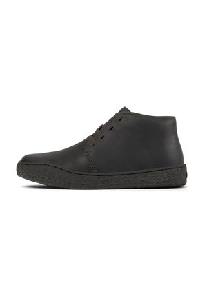 Black leather ankle boots with a rounded toe and textured rubber sole, featuring minimal lacing on the front.