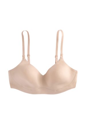 Reggiseno wireless color carne liscio con spalline sottili regolabili e coppe sagomate, progettato per comfort e supporto.