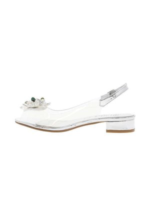 Chaussure slingback transparente avec un petit talon carré, accent floral près de l'orteil et finition brillante sur le matériau.