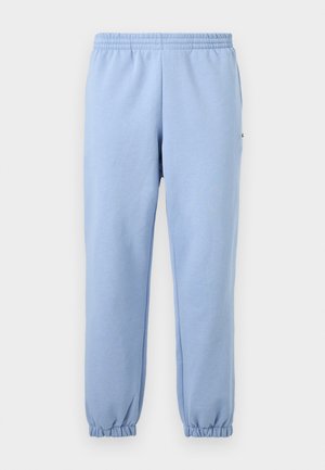 Hellblaue Jogginghose mit elastischem Bund und Bündchen, frontseitig vor neutralem Hintergrund präsentiert.