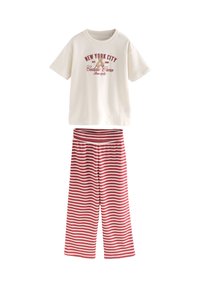 Kortærmet bomulds-T-shirt i creme med rød tryk; matchende røde og hvide stribede bukser med vide ben og elastisk talje.