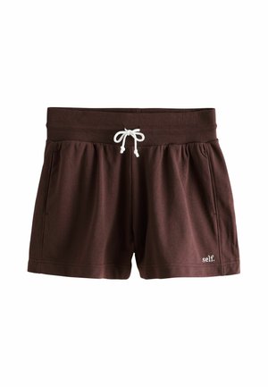 Brown elastic-waist shorts with white drawstring, side pockets, and small white "self." logo on the bottom right leg.