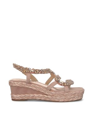 Wedge sandal with a braided jute sole. Upper features a soft pink material and embellished straps with sparkling details.