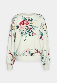 Vit blommig sweatshirt med långa ärmar, prydd med ett livligt blommönster i rosa, rött, grönt och blått. Mjuk textur.