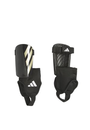 TIRO MTC - Espinilleras - schwarzgold