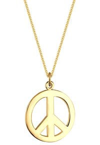 Guld fredssymbol vedhæng på en tynd, struktureret kæde. Cirkulært design med udsnit, poleret finish. Enkel og moderne æstetik.