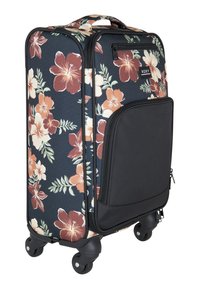 Valise à roulettes noire à motif floral avec un design d'hibiscus bien en vue, dotée d'une poche avant et de roues noires robustes.