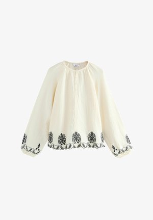 Weiße strukturierte Bluse mit langen Ärmeln, die schwarze florale Stickerei am Saum und an den Bündchen aufweist, sowie einen Knopfverschluss am Hals.