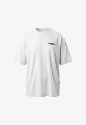T-shirt bianca oversize a maniche corte con piccolo testo nero "Dropsize" stampato sul lato sinistro del petto.