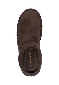 Brown suede slipper with a rounded toe, soft fleece lining, and textured rubber sole. Simple design with no visible hardware or patterns.