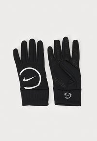 Mănuși atletice negre cu un grip texturat. Prezintă un logo Nike mare, alb, și un logo mai mic pe încheietură. Materialul este un țesătură netedă și elastică.
